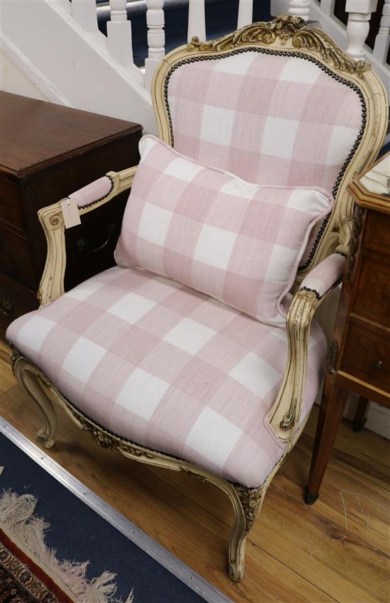 A pair of French cream painted fauteuils